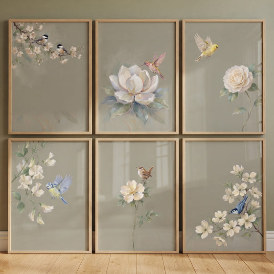 Muted sage garden bird floral wall art set of 6 features birds and flowers inside thin light wood frames.