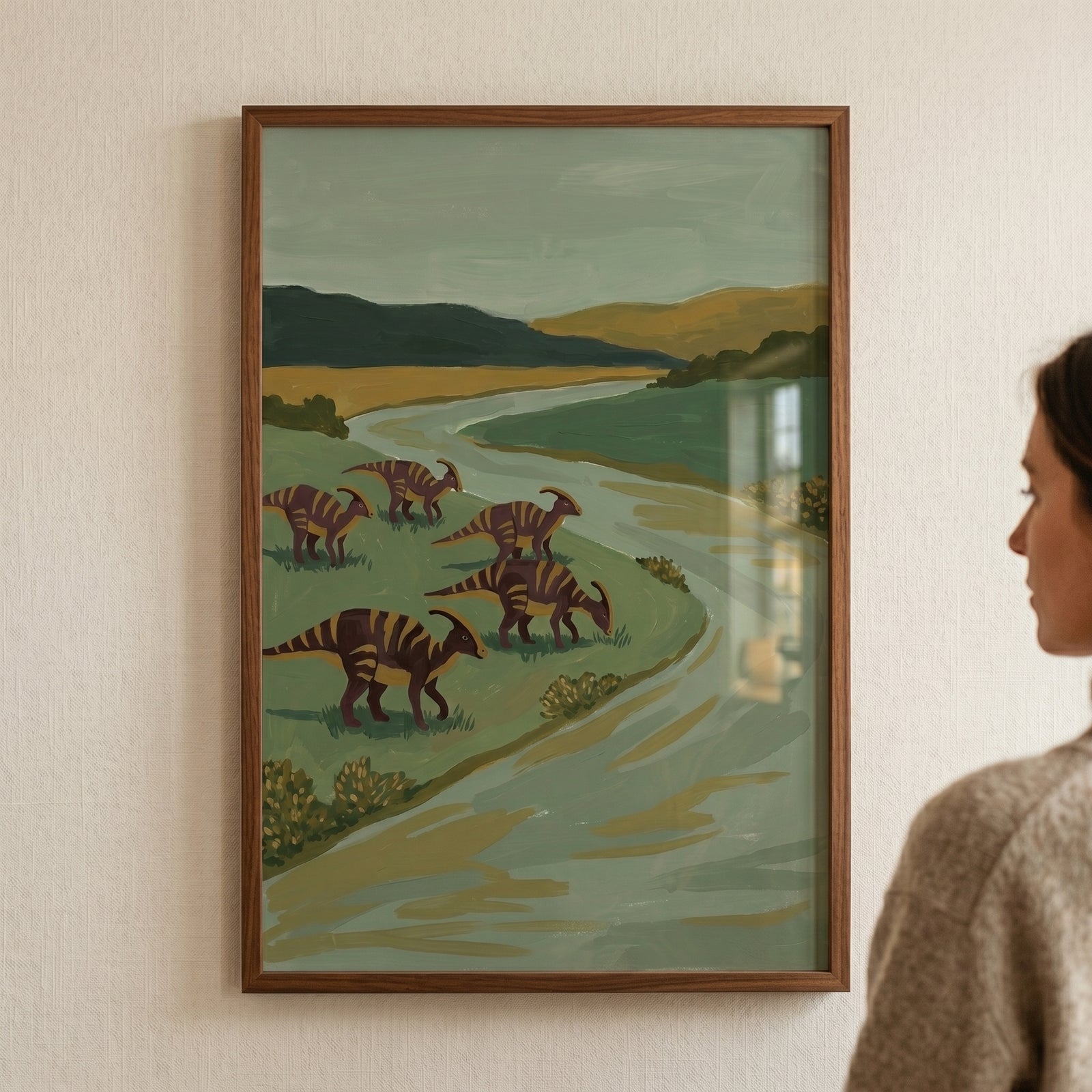 Muted sage green dinosaur wall art featuring five striped dinosaurs near a river in a landscape with hills.