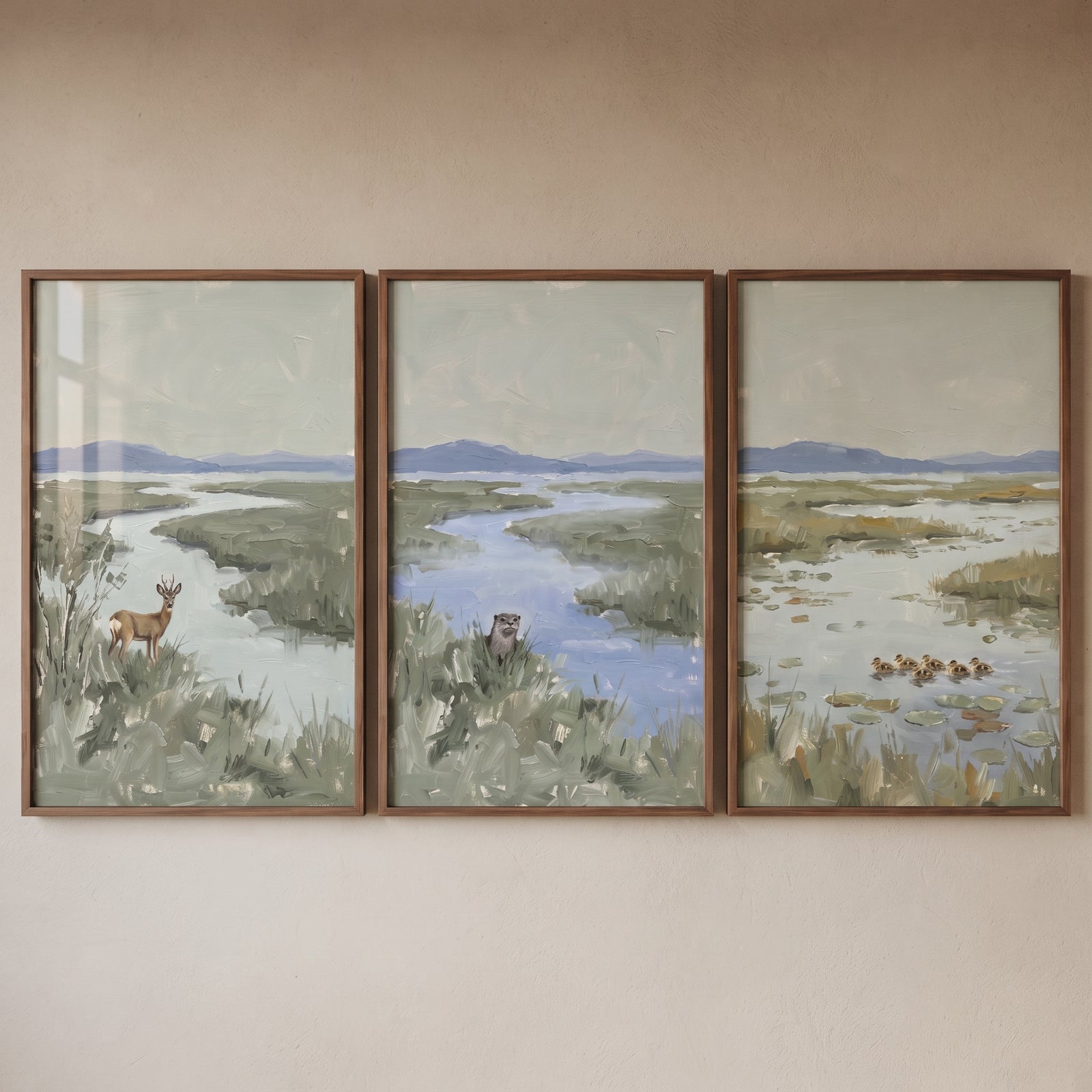 Muted sage green wildlife animals wall art set of 3 depicting a deer, otter, and ducklings in a marshland landscape.