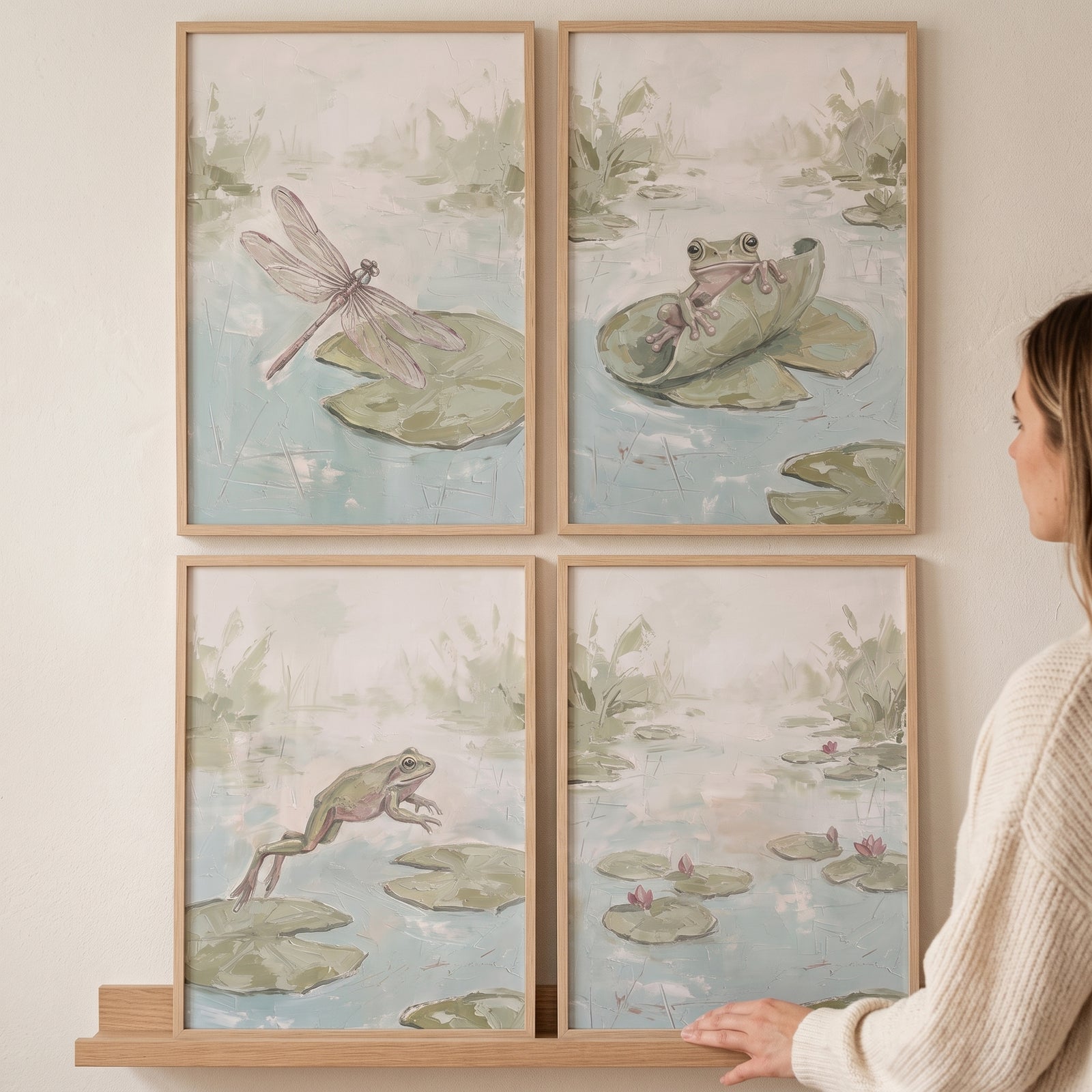 A woman stands by a muted serene pond wall art set of 4 showing frogs and a dragonfly in wooden frames.