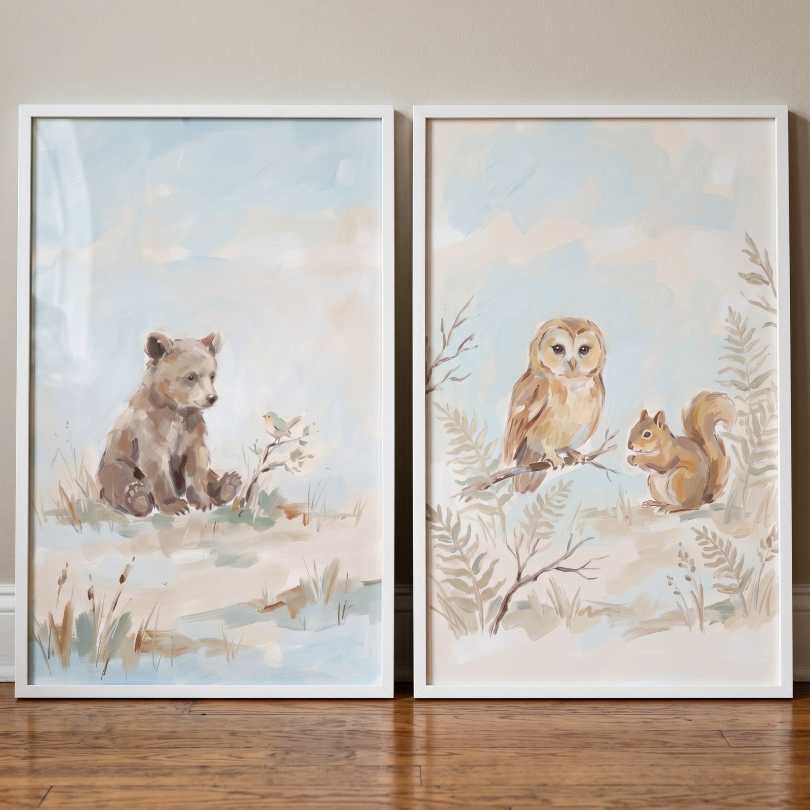 Muted tone woodland animals wall art set of 2 features a bear cub, owl, and squirrel in soft colors with white frames.