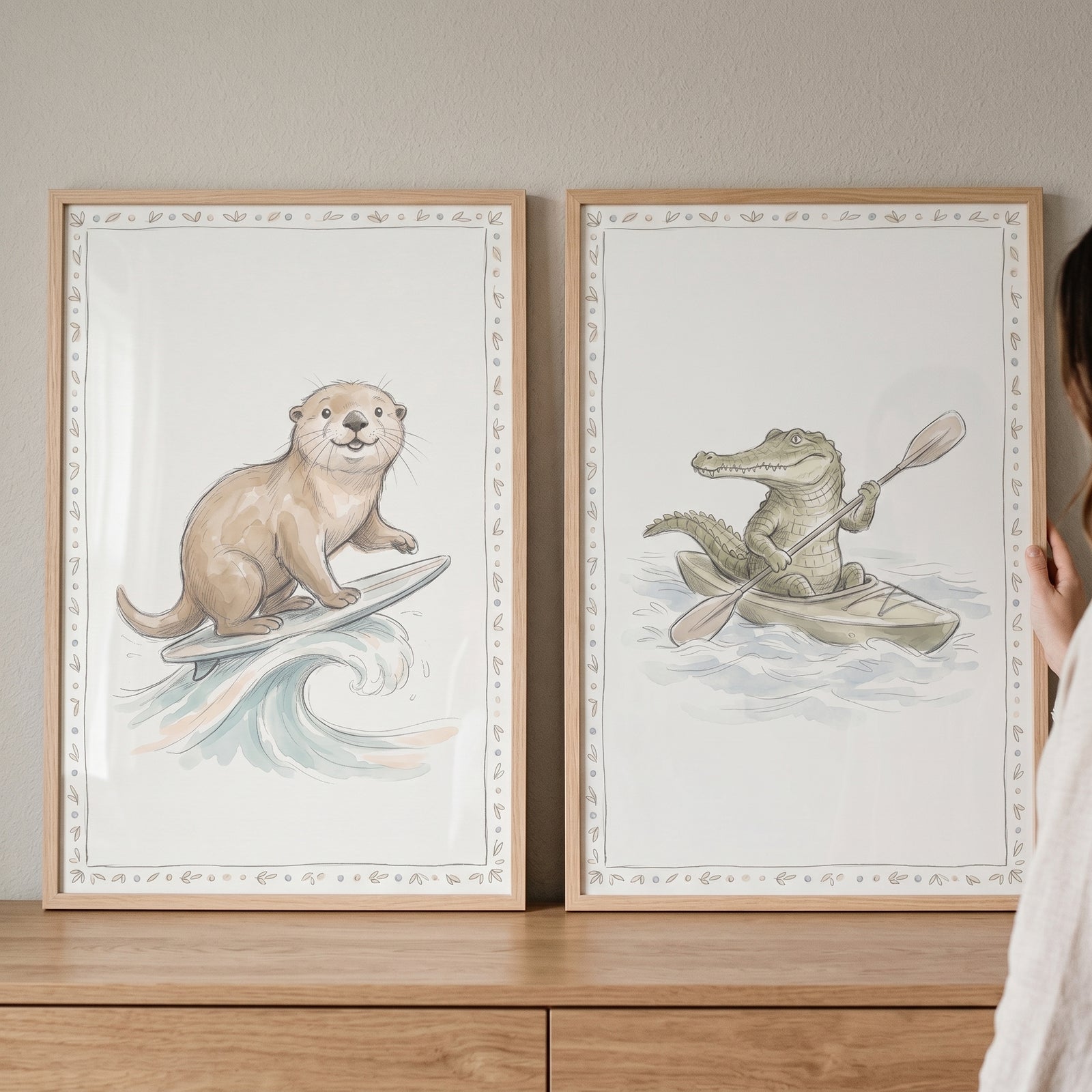 Otter surfing and a crocodile kayaking in this muted watercolor aquatic animals wall art set of 2.