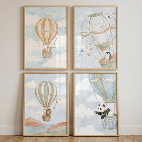 Muted watercolor balloon animals wall art set of 4 featuring a fox, penguin, lion, and panda in hot air balloons.