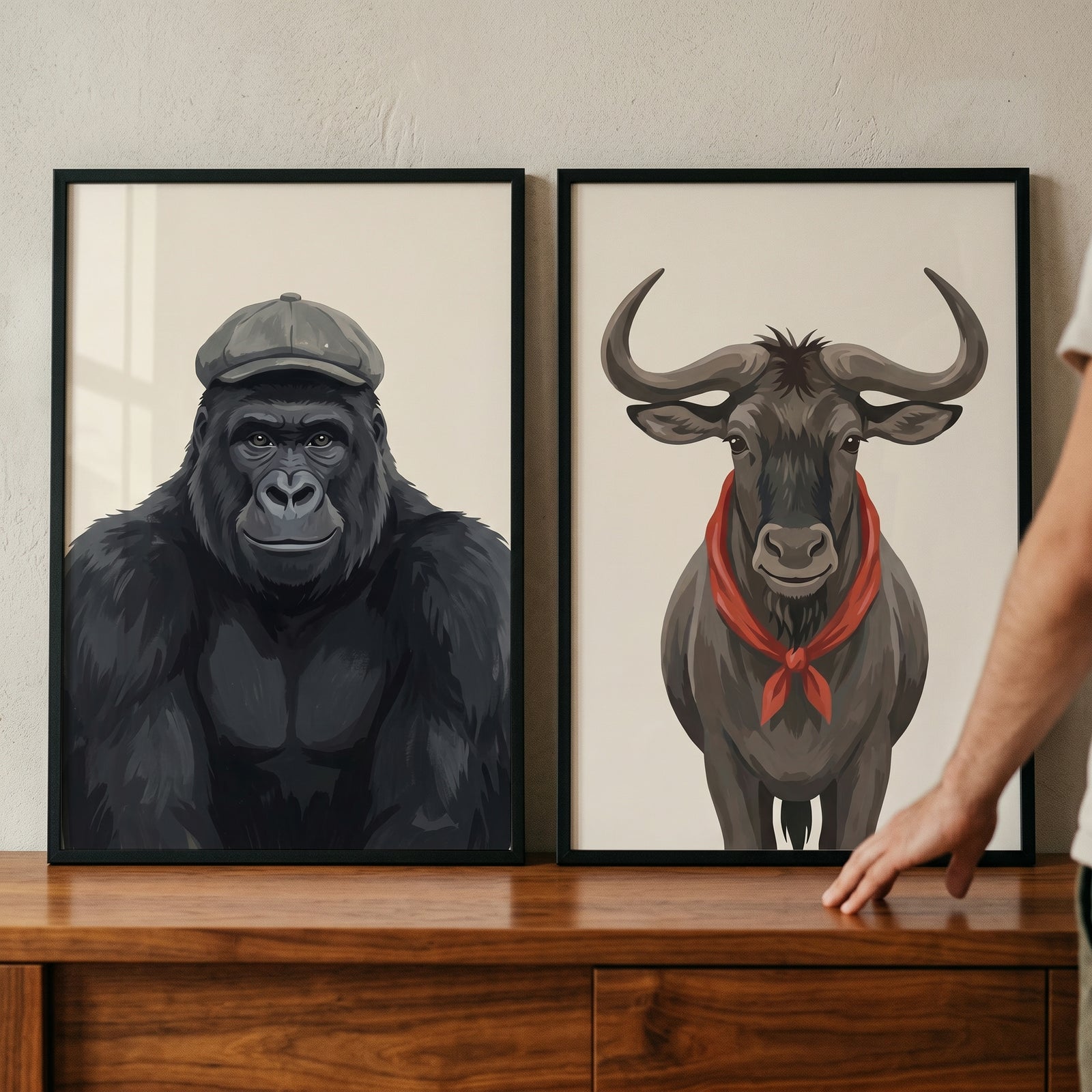 Neutral accessorized safari animal wall art set of 2 featuring a gorilla in a cap and a wildebeest in a red scarf.