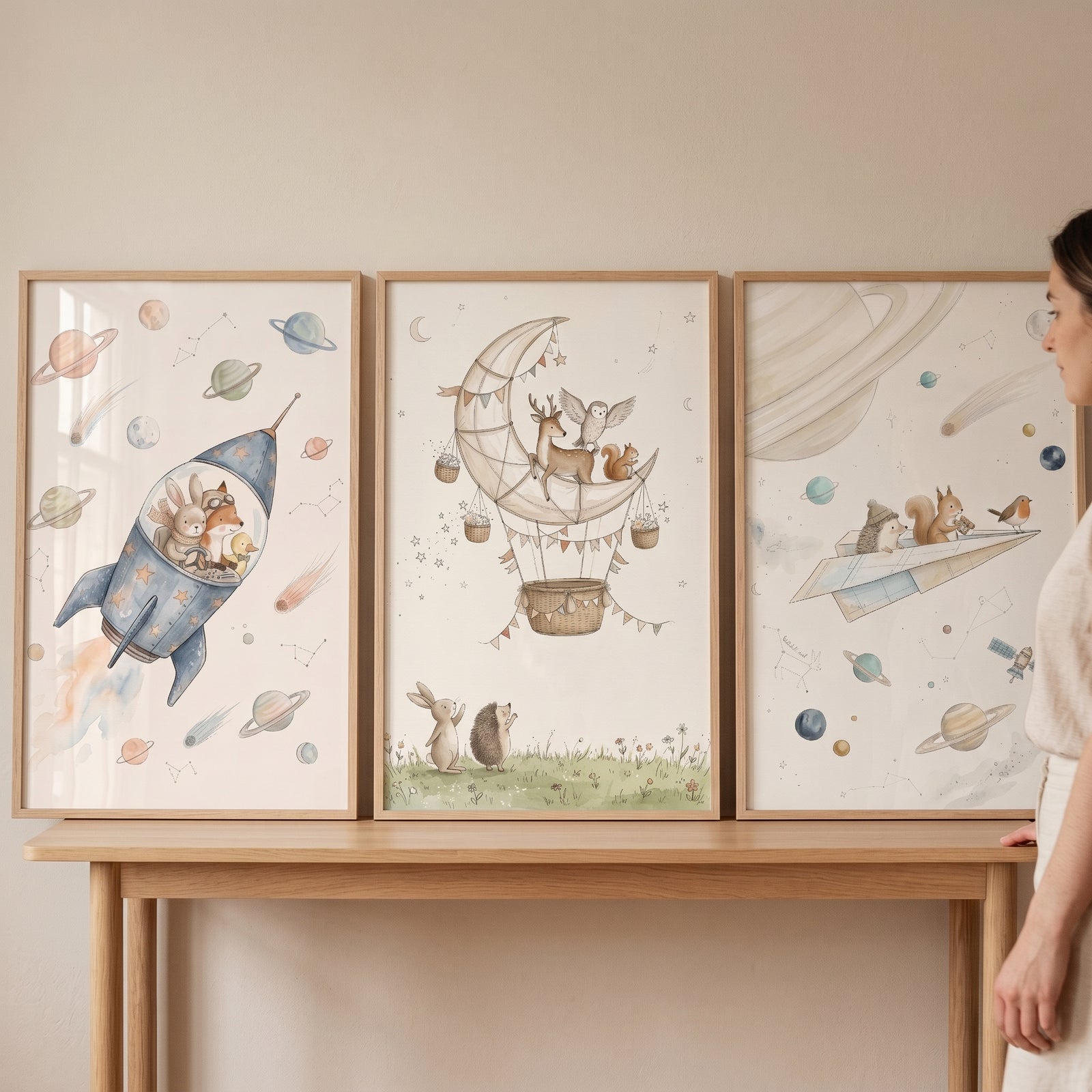 Neutral celestial woodland animals wall art set of 3 features forest creatures in a rocket, moon balloon, and paper plane.