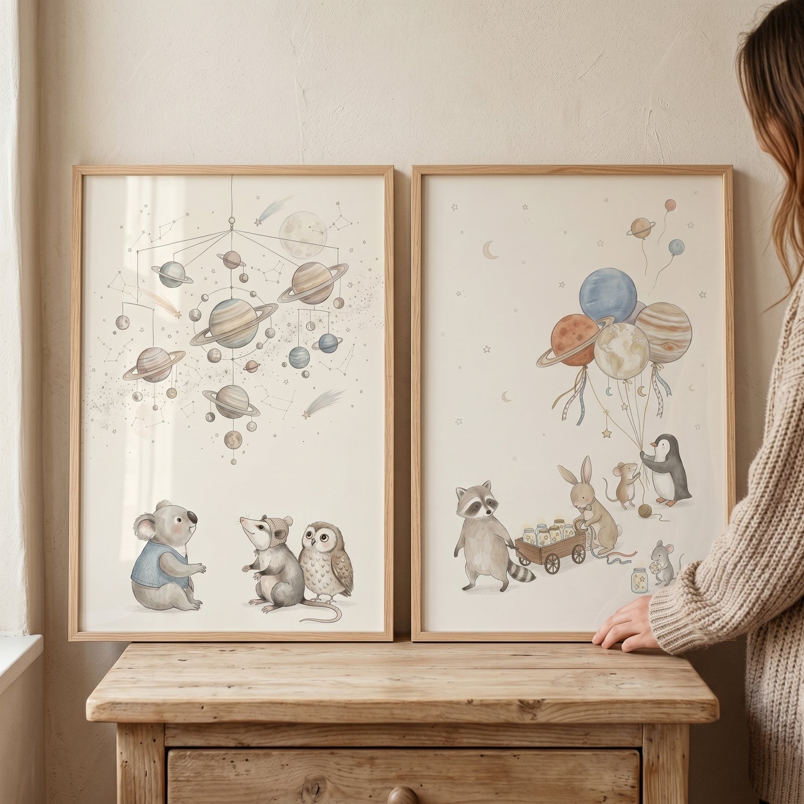 Neutral earthy celestial animals wall art set of 2 featuring cute animals, planets, and a solar system mobile.