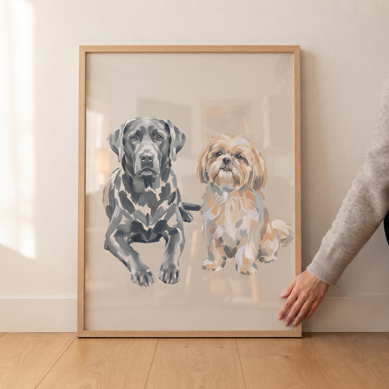 Hand touches neutral labrador shih tzu wall art in a wood frame featuring a black lab and a tan shih tzu.