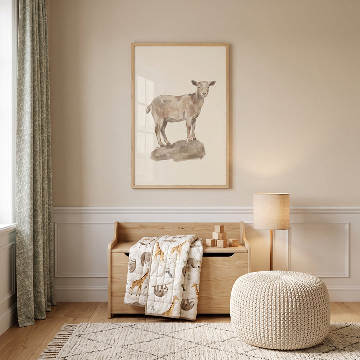 Neutral rock standing goat wall art hangs above a wooden chest, animal print quilt, floor lamp, and round woven pouf.