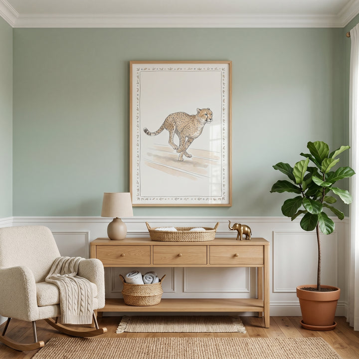 Cream rocker and wood console table in a sage green room featuring neutral running cheetah artwork and a large potted plant.