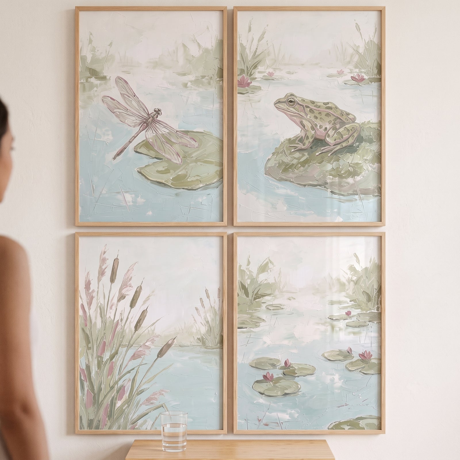 Neutral sage green pond animals wall art set of 4 featuring a frog, dragonfly, and cattails in light wooden frames.