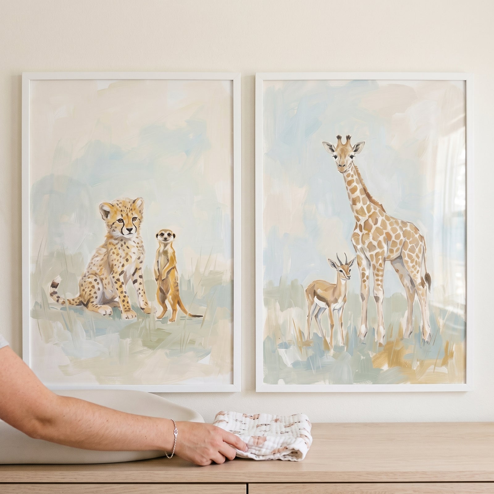 Neutral tone safari animals artwork set of 2 with watercolor cheetah, meerkat, giraffe, and gazelle in white frames.