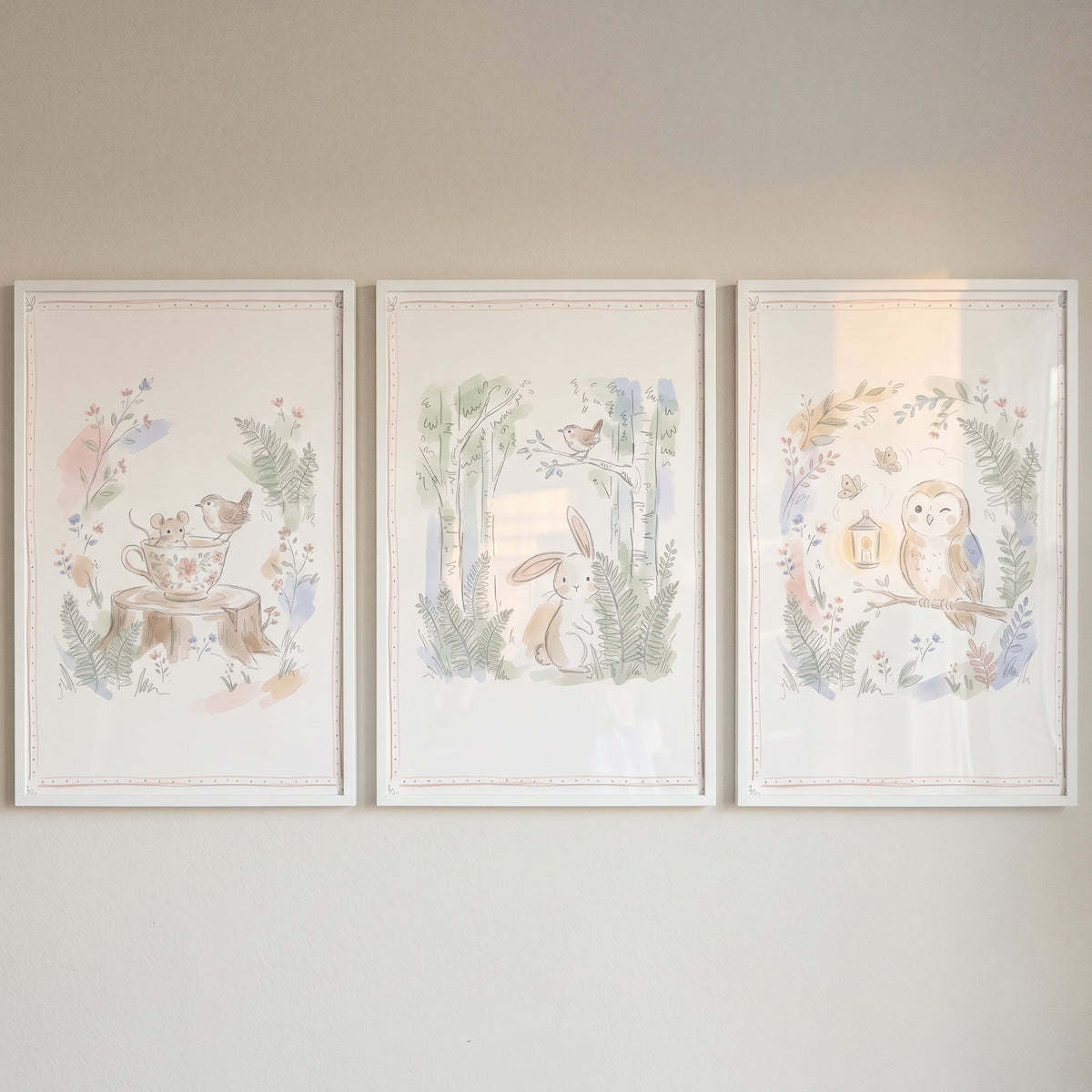 Neutral tone woodland animals wall art set of 3 featuring a mouse in a teacup, a rabbit, and an owl in watercolor style.