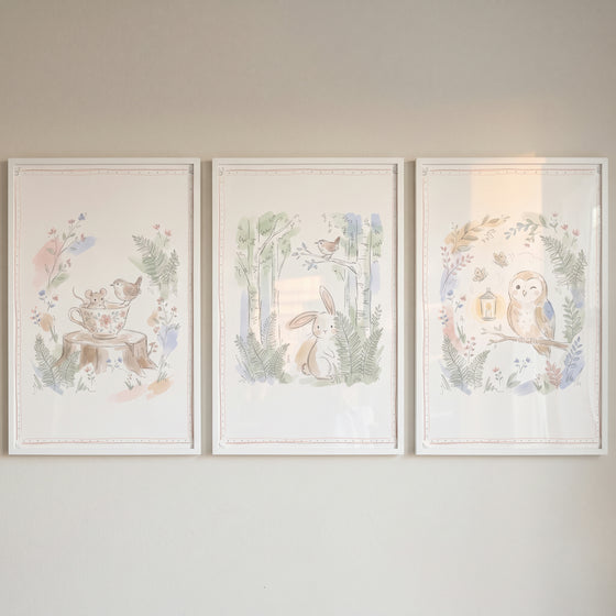 Neutral tone woodland animals wall art set of 3 featuring a mouse in a teacup, a rabbit, and an owl in watercolor style.