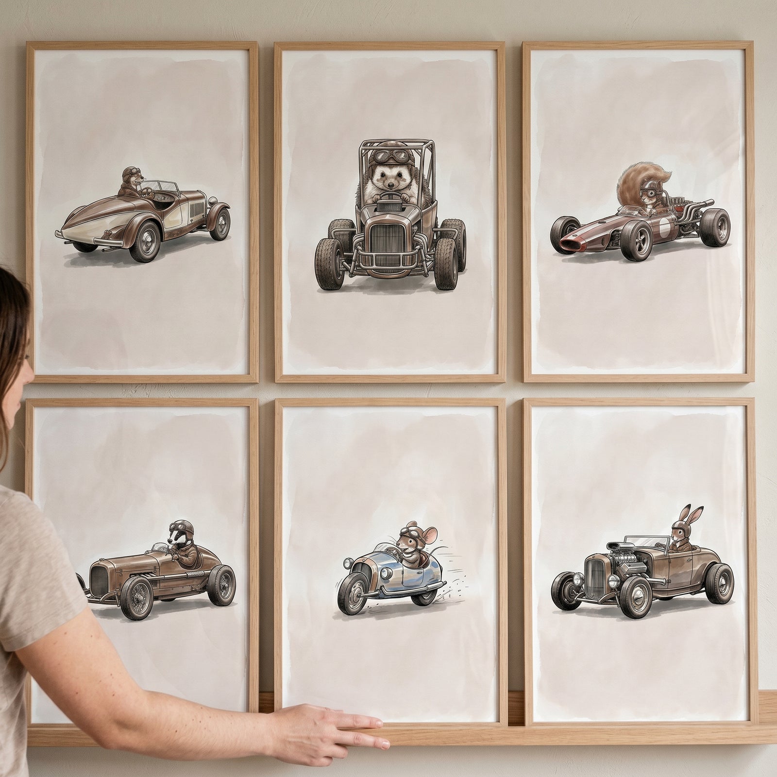 A neutral tones racing animal wall art set of 6 featuring woodland animals driving vintage race cars in light wood frames.