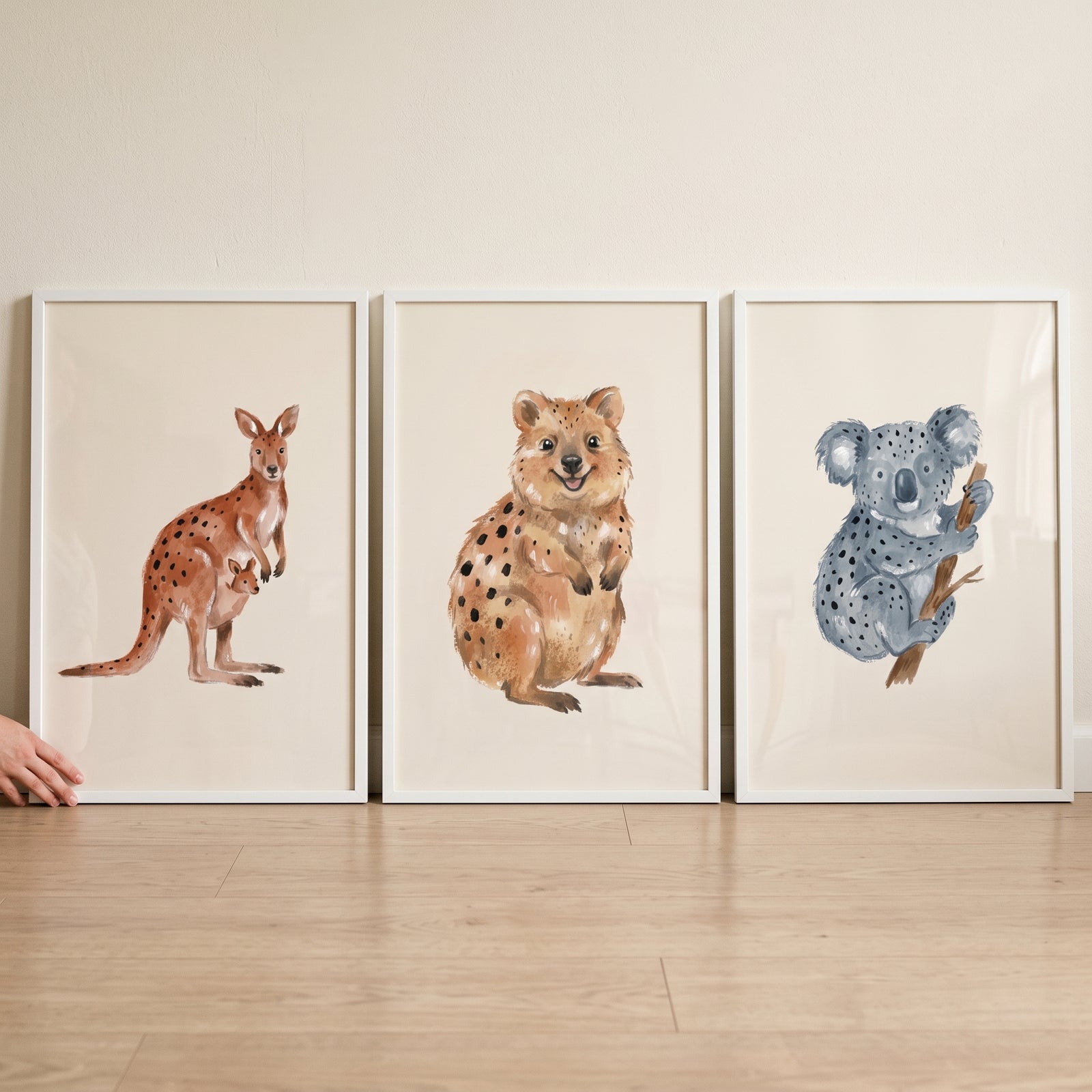 Neutral watercolor australian animal wall art set of 3 featuring a kangaroo, quokka, and koala in white frames.