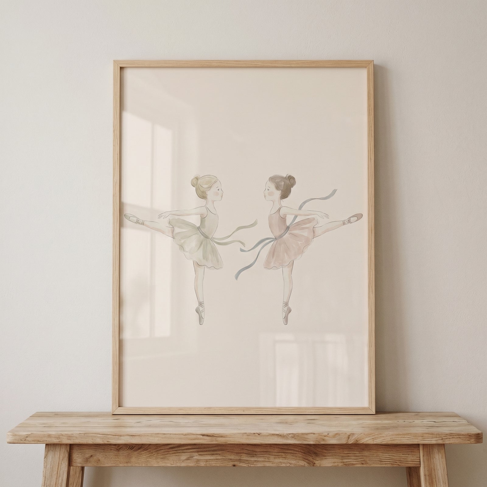 Framed neutral watercolor ballerina wall art featuring two dancers in soft tutus resting on a rustic wooden bench.