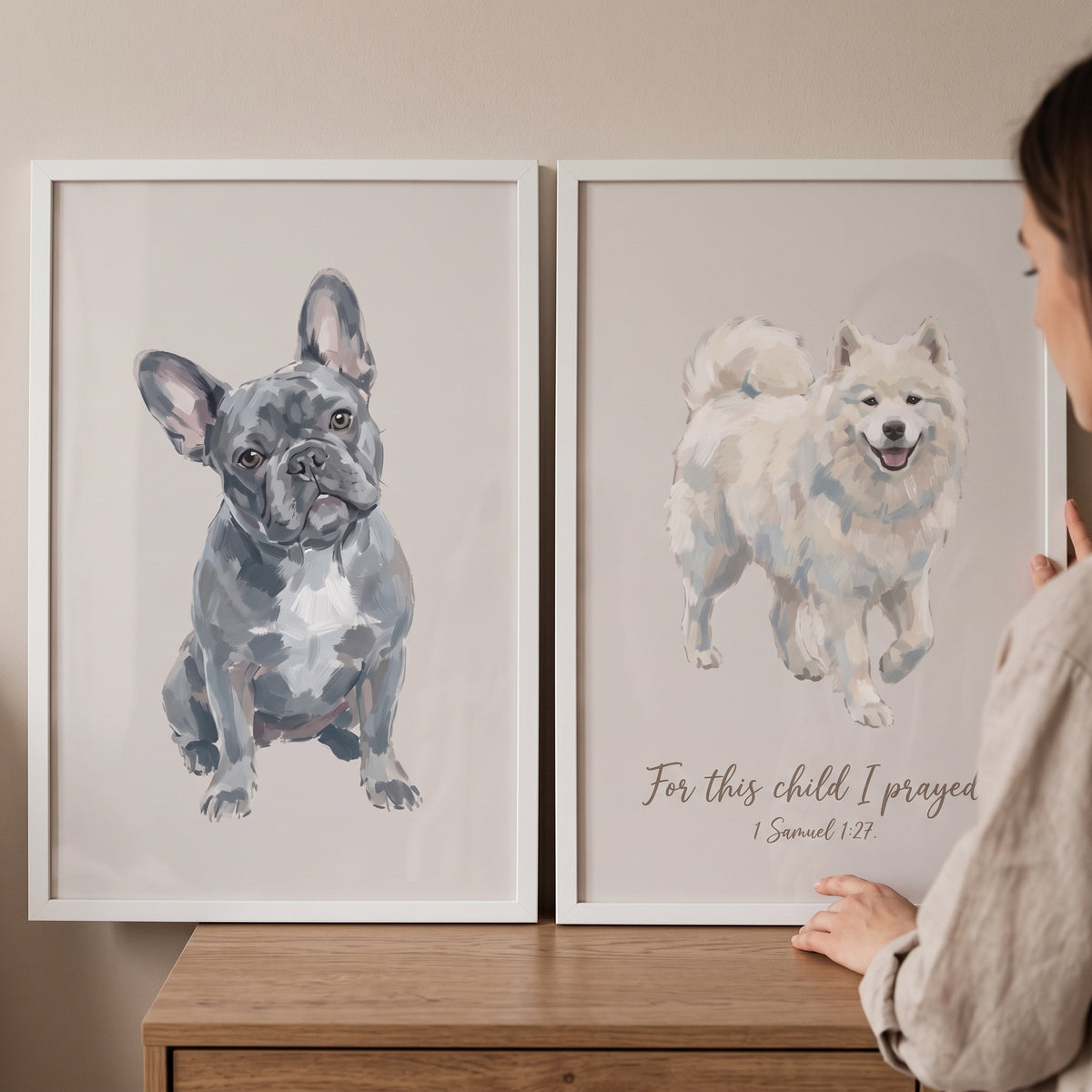 Two framed illustrations of a French bulldog and a Samoyed in this neutral watercolor pet dog wall art set of 2.
