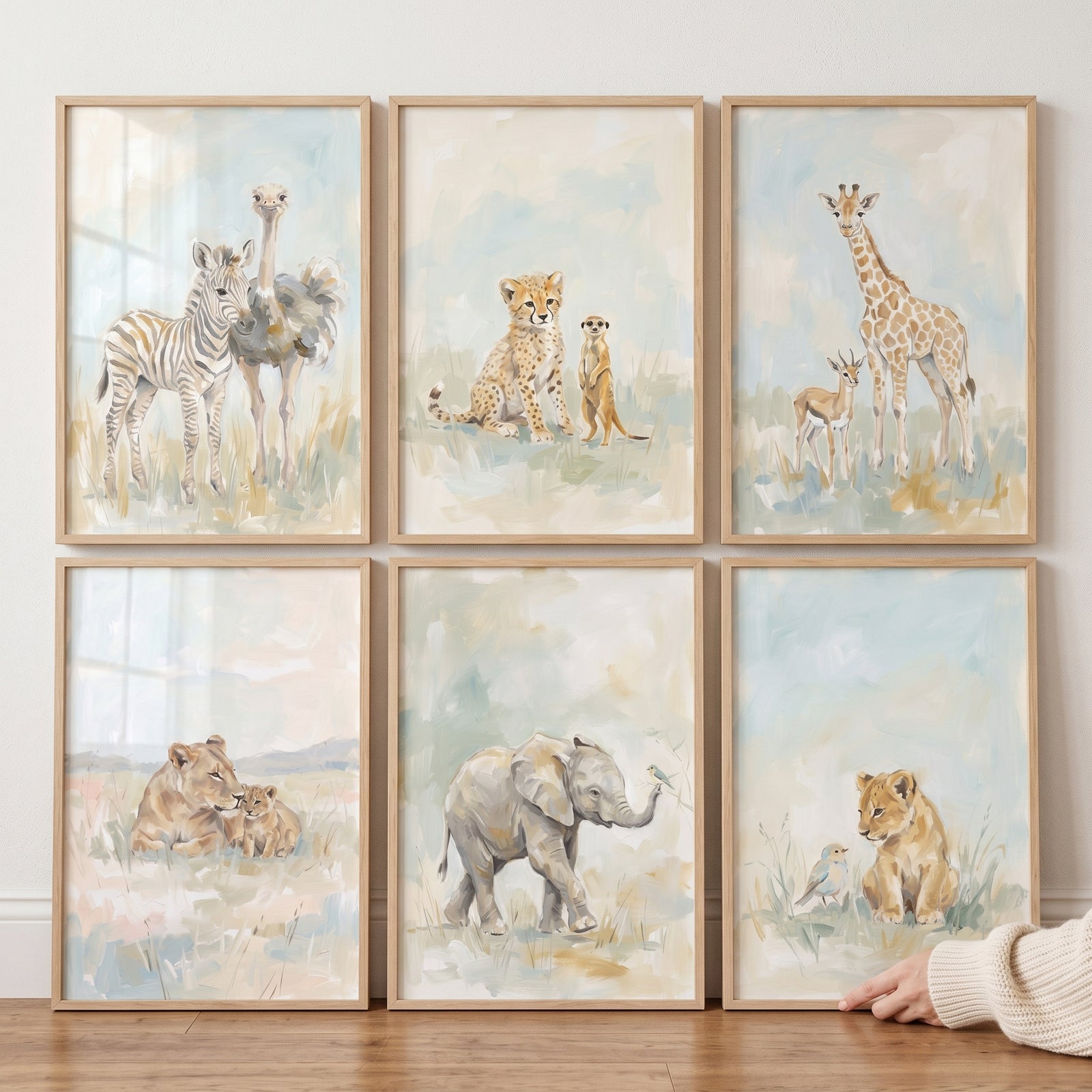 Neutral watercolor safari animals wall art set of 6 featuring lions, elephant, giraffe, zebra, ostrich, and cheetah.