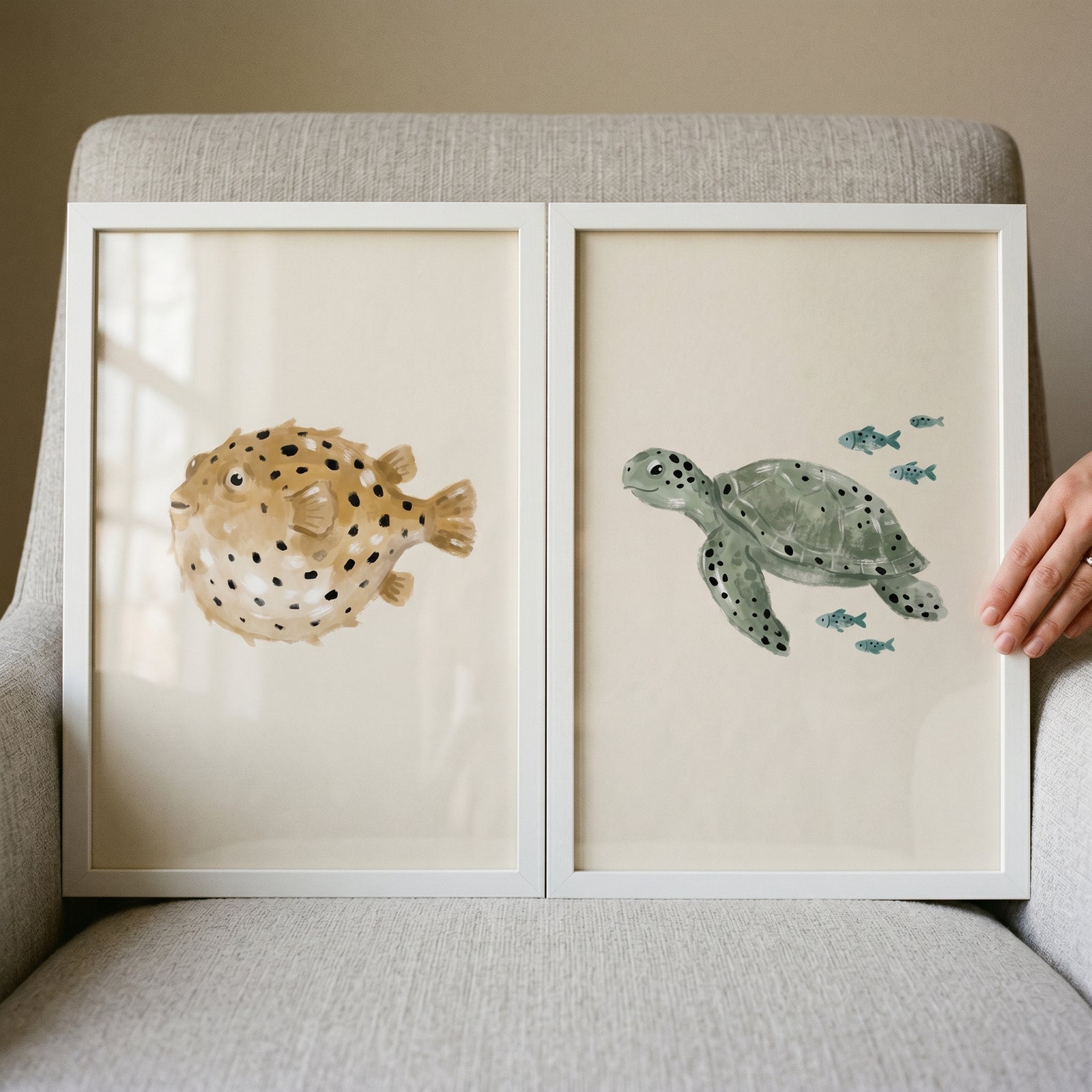 Neutral watercolor sea creature print set of 2 featuring a tan pufferfish and a green sea turtle in white frames.