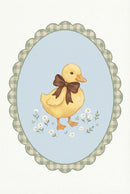 Vintage style oval framed illustration of a duckling with a brown bow standing among small white flowers. The scalloped border features a soft green gingham pattern around a pale blue background.

