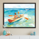 Artwork shows two young boys in swim trunks rowing a small wooden boat across sunlit turquoise waters, with a seagull flying just ahead of them. The framed artwork hangs on a beige wall above a white dresser decorated with nautical-themed items, creating a breezy, coastal atmosphere.