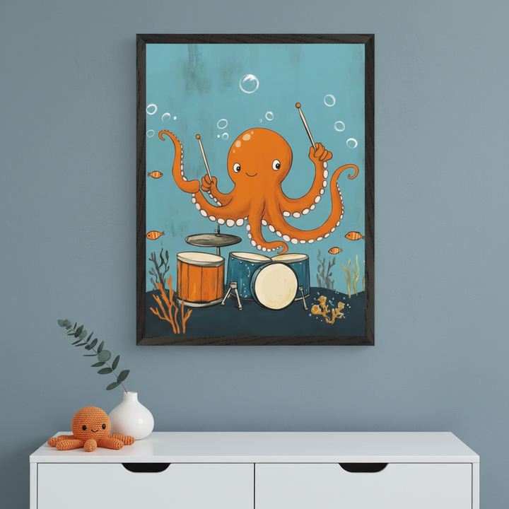 Modern kid's room with a white dresser. Above it hangs a framed print of a cartoon orange octopus playing drums underwater. A white vase with a green sprig and a crocheted orange octopus toy sit on the dresser.