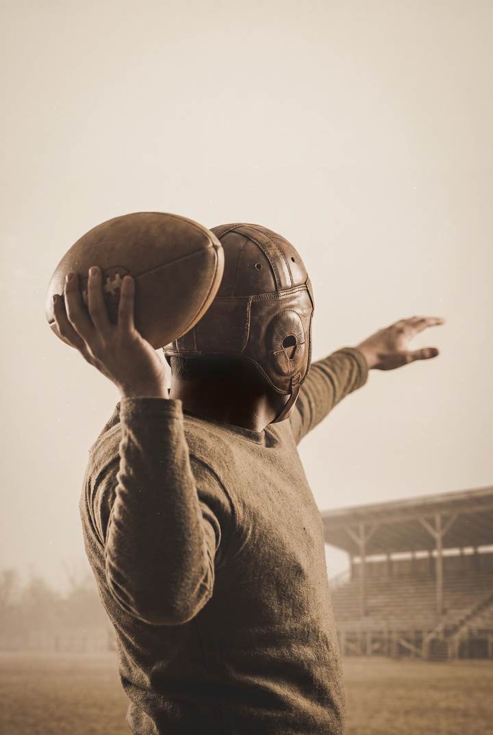 Sepia vintage football player preparing to throw in this old leather helmet quarterback sports wall art.