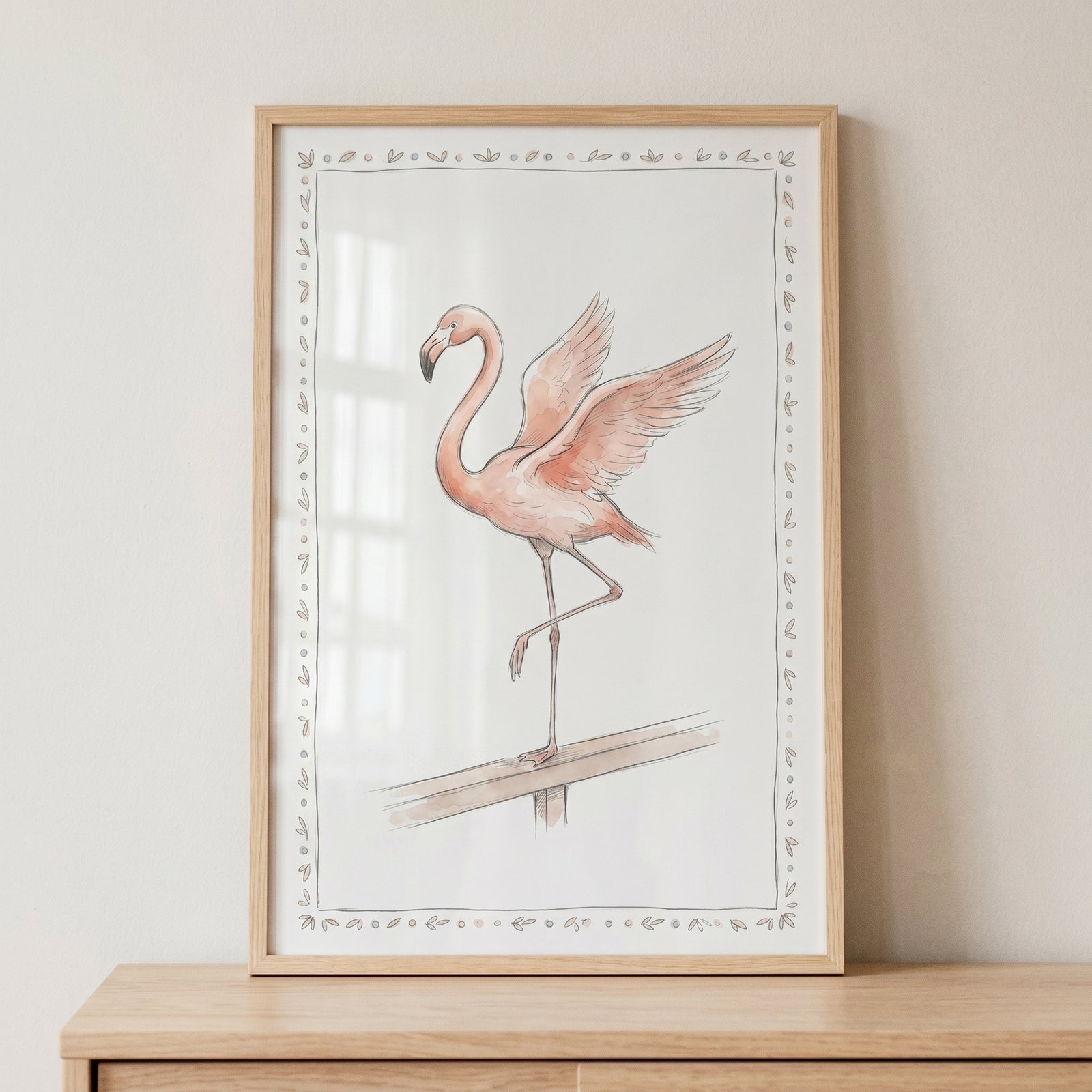 Open wing pink flamingo wall art in a light wood frame shows a bird with spread wings standing on a railing.