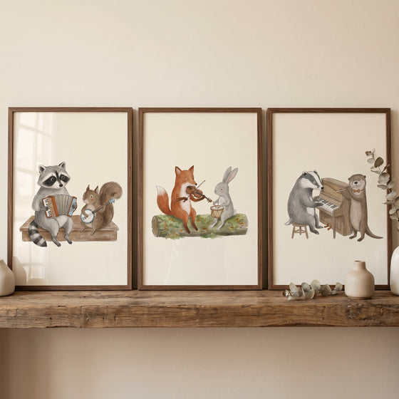 Organic tone forest animal wall art set of 3 features a raccoon, fox, and badger playing instruments in wood frames.