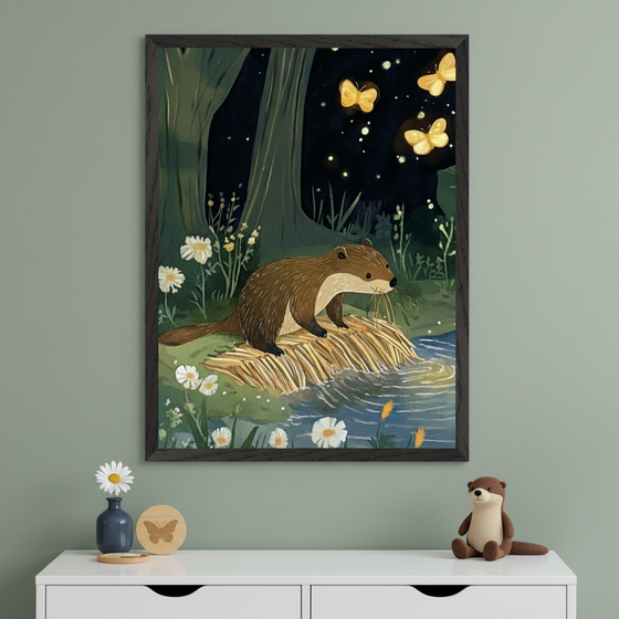Modern kid's room with a white dresser against a sage green wall. A large framed illustration of an otter by a stream in a dark forest with glowing butterflies hangs above the dresser. On the dresser are a small vase with a daisy, wooden coasters, and an otter plush.