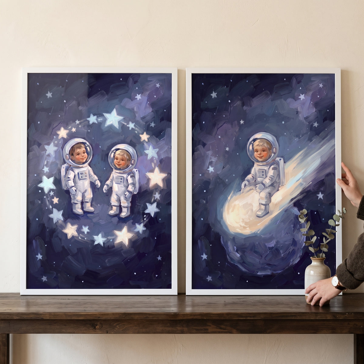 Outer space baby astronaut wall art set of 2 with infants in spacesuits among glowing stars and riding a bright comet.