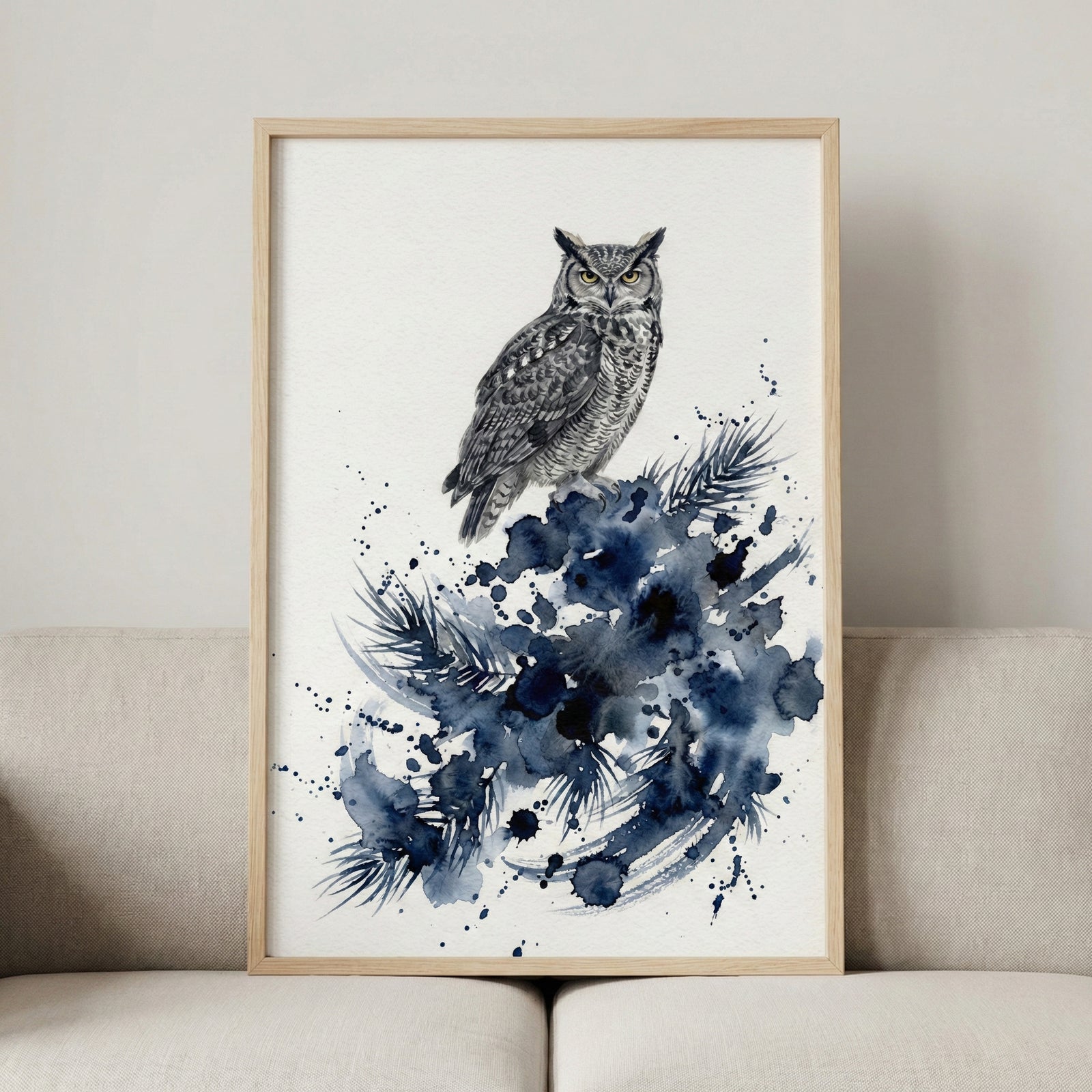 A hand holding a large wood-framed watercolor giraffe painting against a neutral wall.