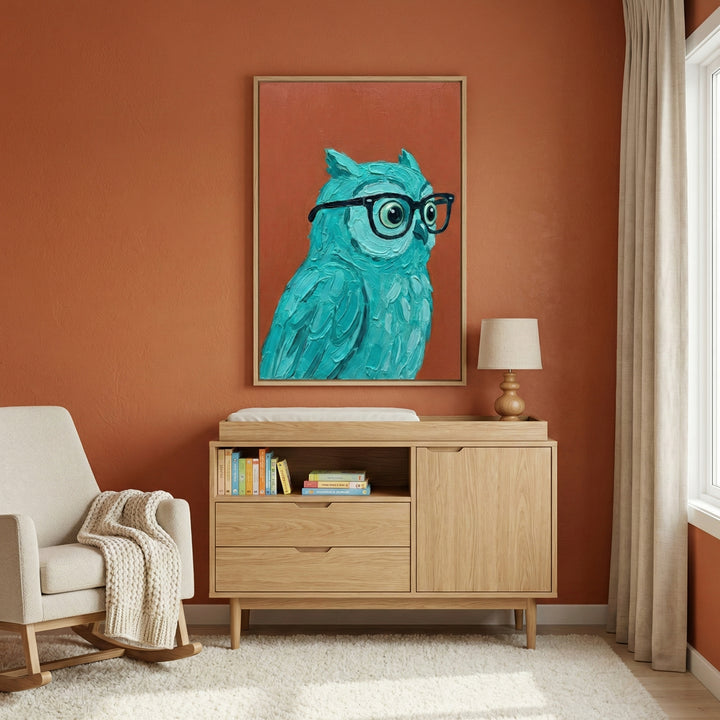 A brightly colored teal owl with glasses adds a quirky, intelligent charm to a cozy, modern nursery. The art piece pops against the terracotta wall, bringing personality and fun to the space.