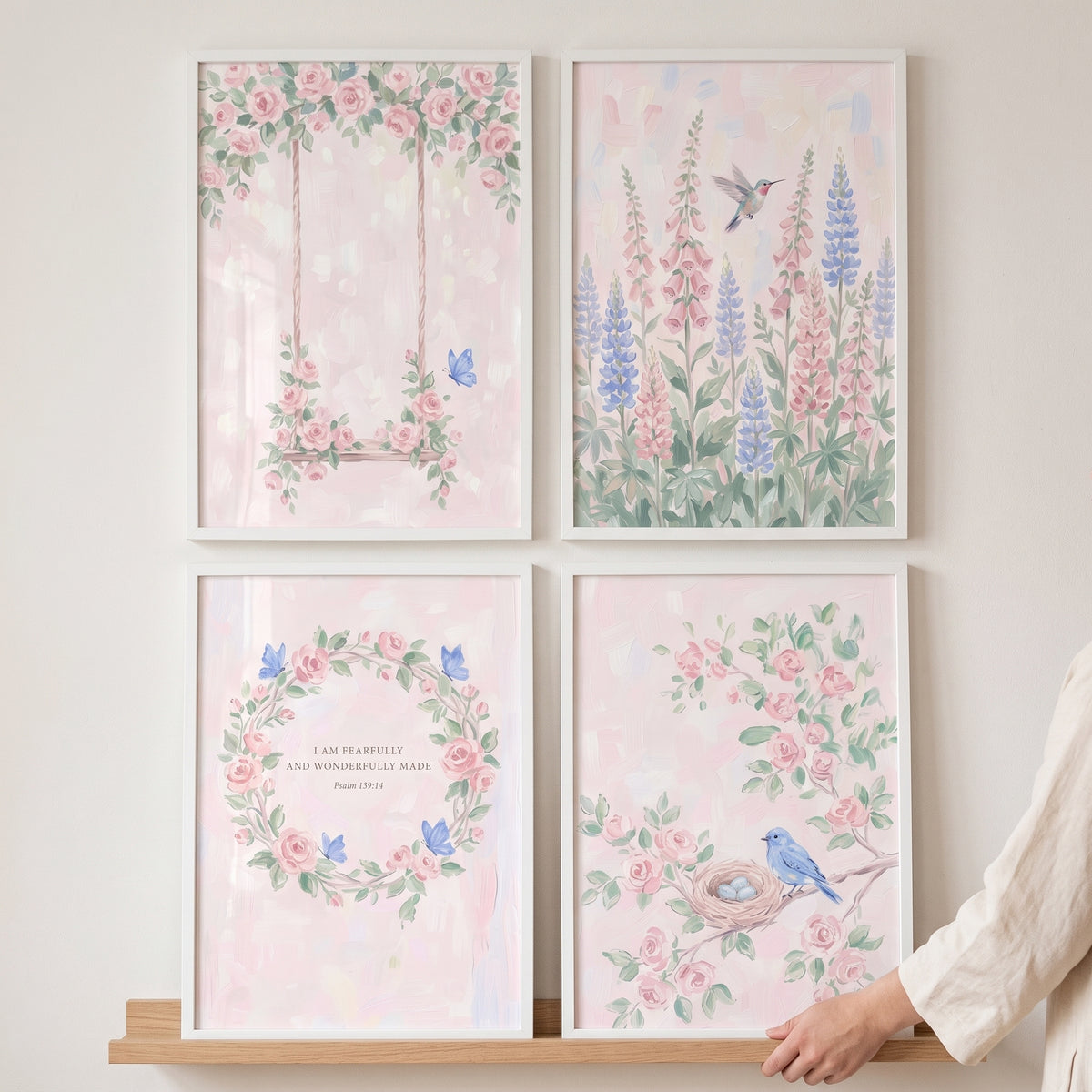 Painterly blush botanical garden wall art set of 4 featuring a swing, hummingbird, floral wreath, and blue bird with nest.