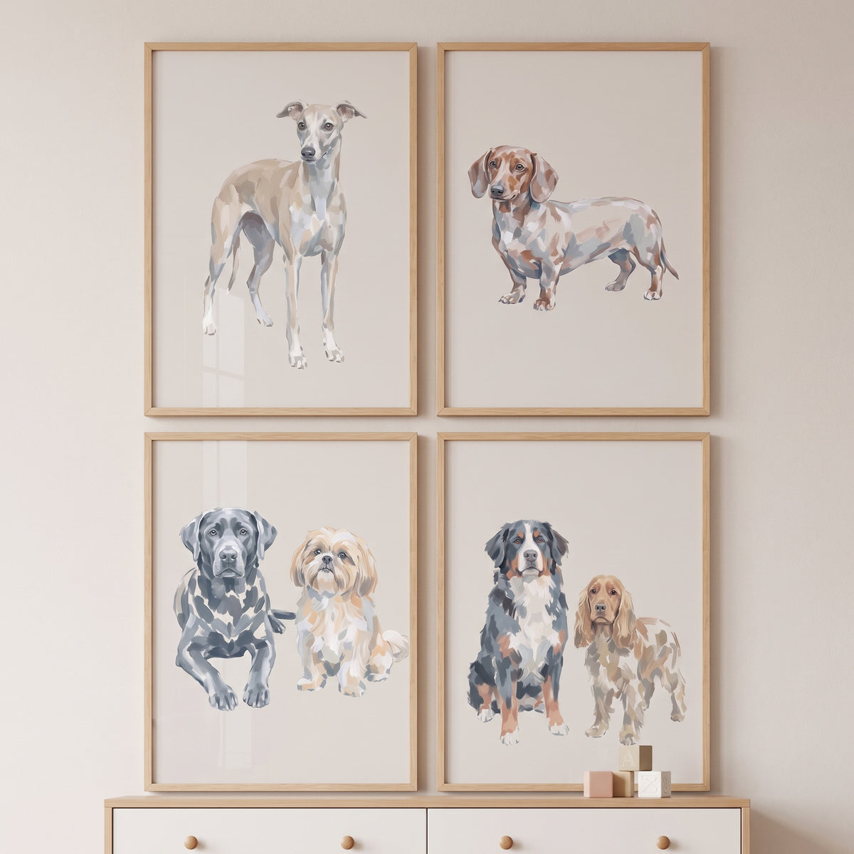 Various breeds feature in this painterly earth tone dogs wall art set of 4 displayed in light wood frames.