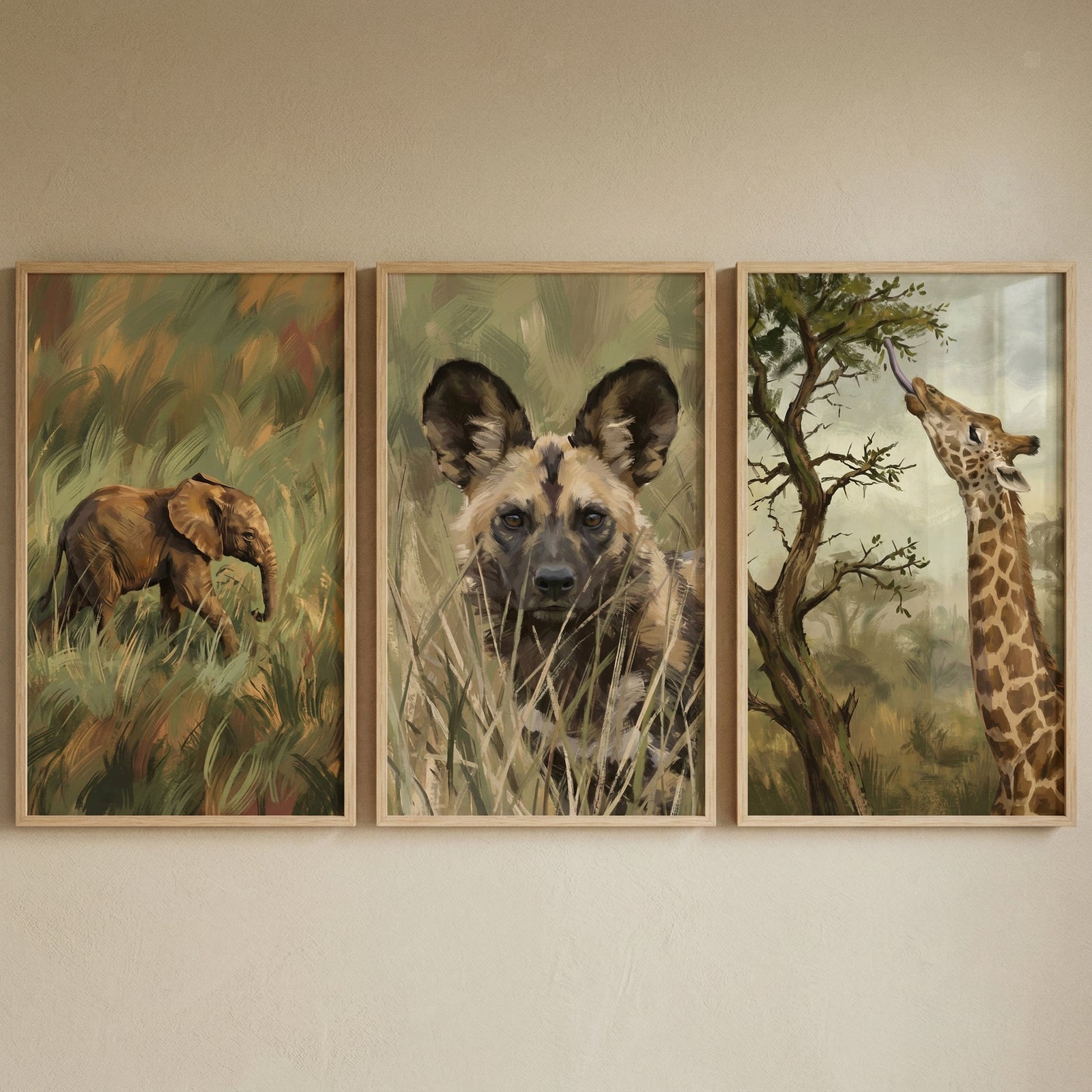 Painterly earthy safari animal wall art set of 3 featuring a baby elephant, an African wild dog, and a giraffe.