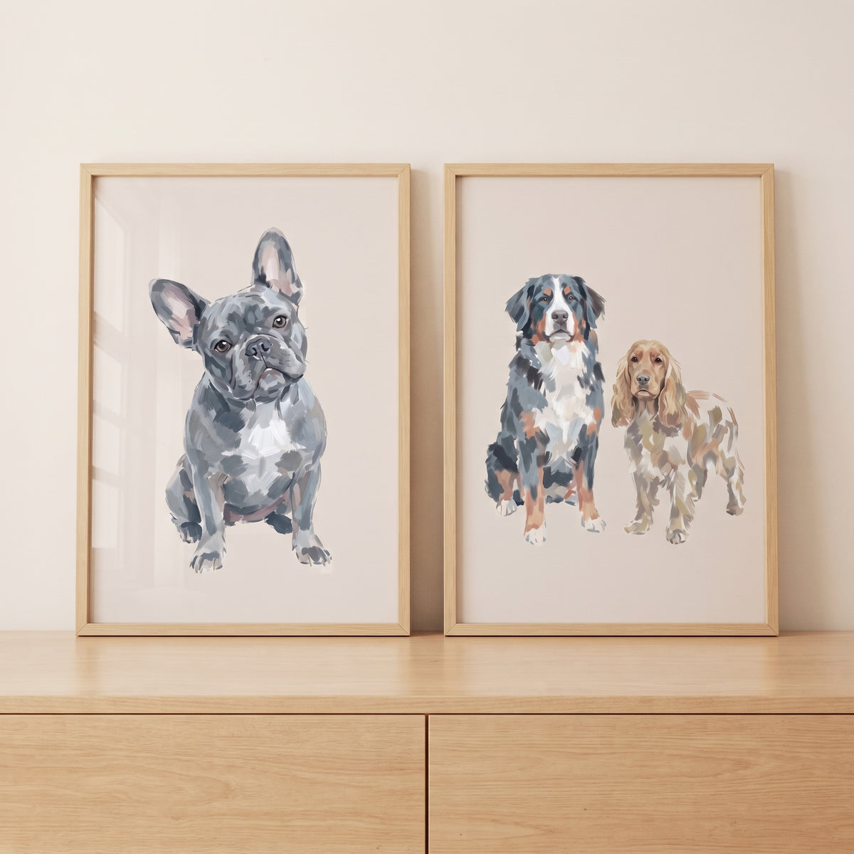 Two framed illustrations on a wooden dresser. Painterly neutral pet dogs wall art set of 2 featuring three different breeds.