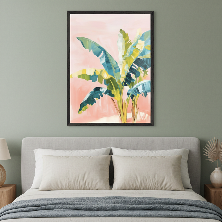 Modern bedroom with a gray upholstered bed and beige pillows. A large framed painterly artwork of green and yellow tropical banana leaves on a pink background hangs above the bed.