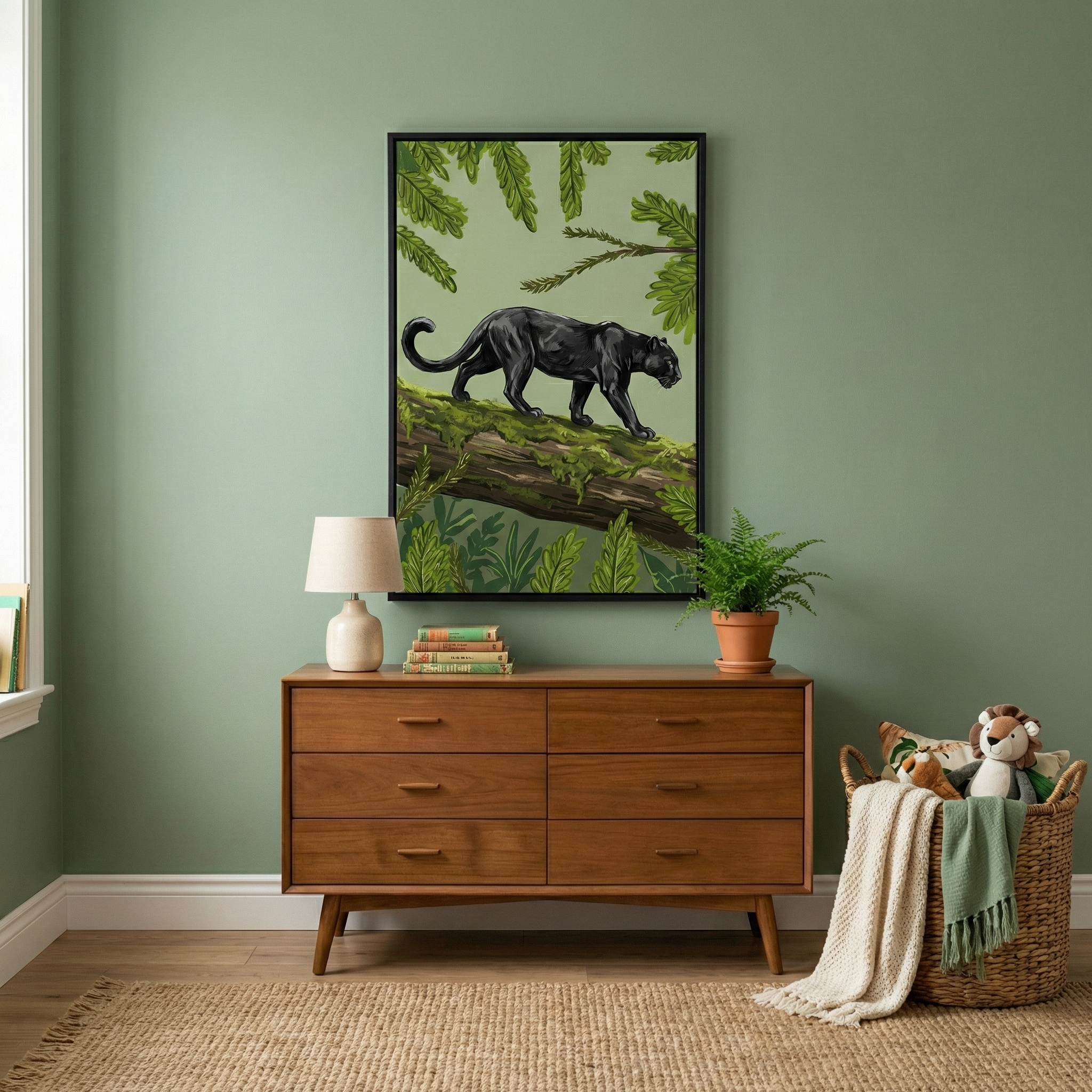 A cozy room features a wooden dresser topped with a lamp, a stack of books, and a potted plant. Above, a framed artwork of a black panther walking on a tree trunk is set against a green background. A woven basket with stuffed animals and a blanket sits on the floor beside a textured rug.
