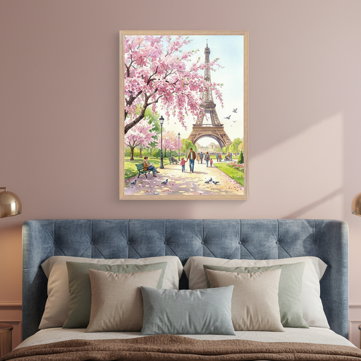 Bedroom with a blue tufted headboard bed. A framed watercolor painting of a spring scene in Paris, featuring the Eiffel Tower, cherry blossom trees, and people in a park, hangs centered above the bed.