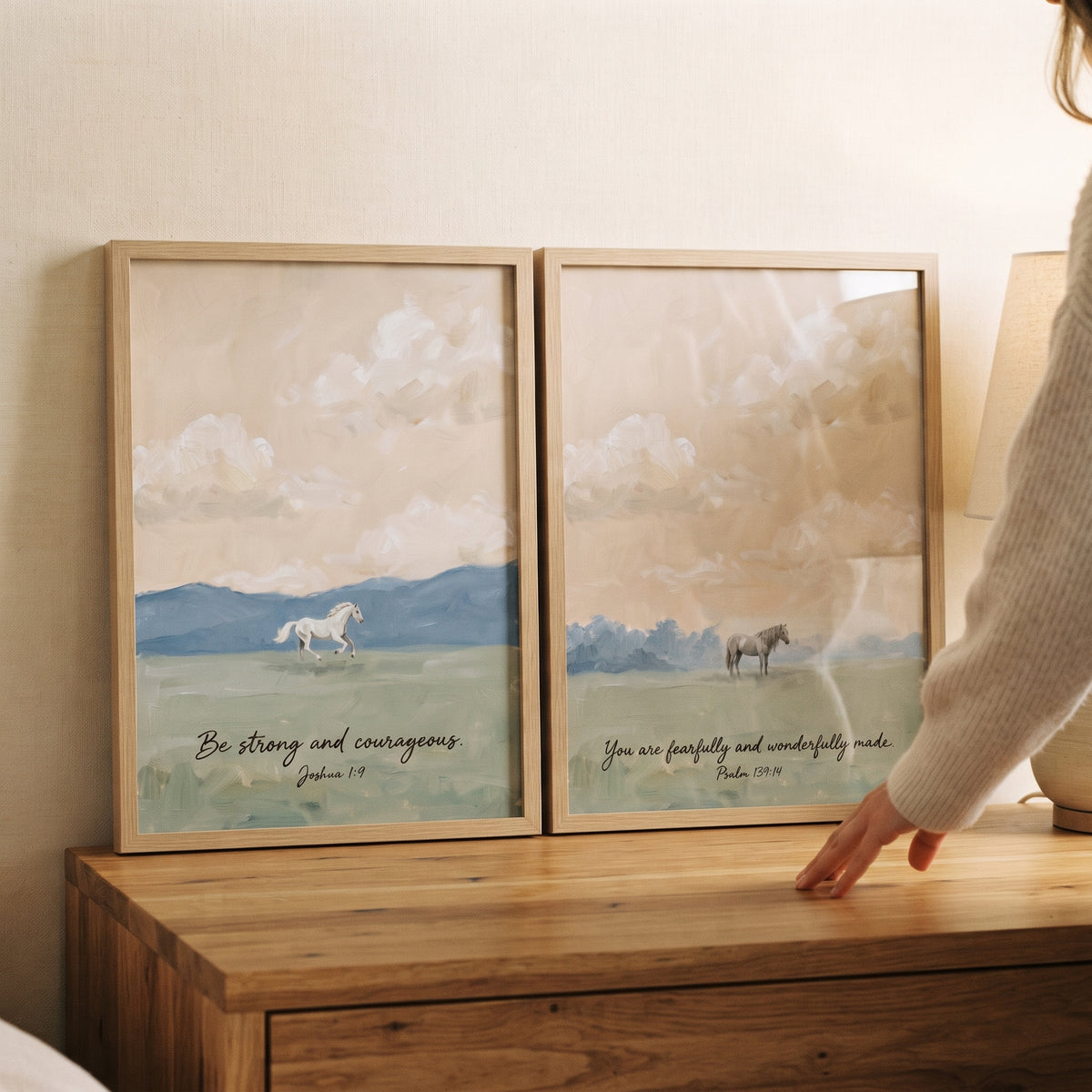 Pastel bible verse horse wall art set of 2 in wood frames on a dresser featuring horses in soft landscape scenes.