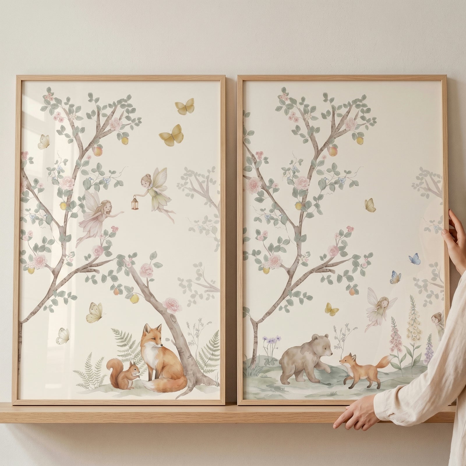 Pastel blossom tree fairies wall art set of 2 with watercolor foxes, a bear, and a squirrel in soft forest scenes.