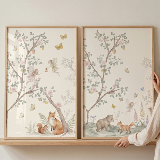 Pastel blossom tree fairies wall art set of 2 with watercolor foxes, a bear, and a squirrel in soft forest scenes.