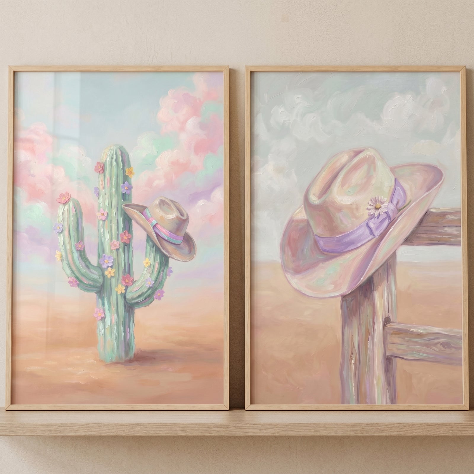 Pastel desert cowboy hat wall art set of 2 with a flowered cactus and a hat resting on a rustic wooden fence post.