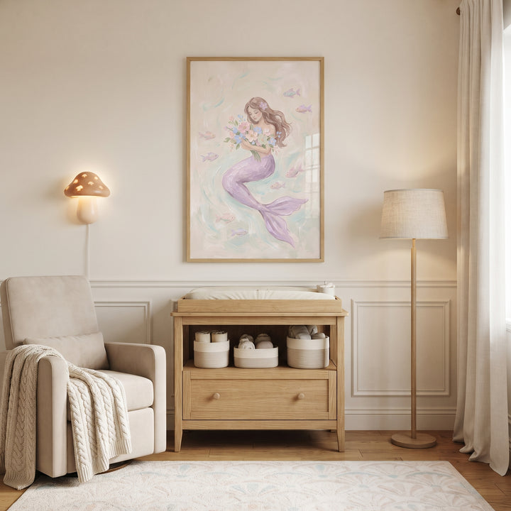 Nursery with a beige chair and pastel floral bouquet mermaid wall art above a wooden changing table.
