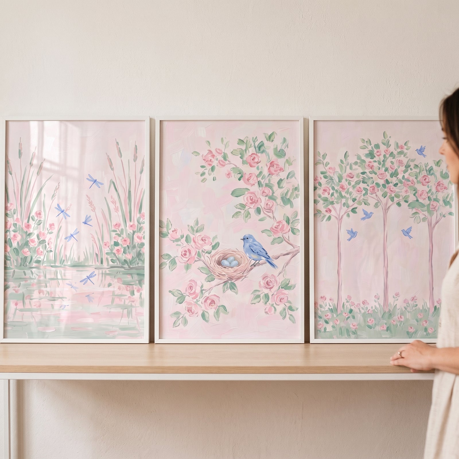 Pastel floral pink garden wall art set of 3 featuring dragonflies, a bird nest, and trees in soft watercolor tones.