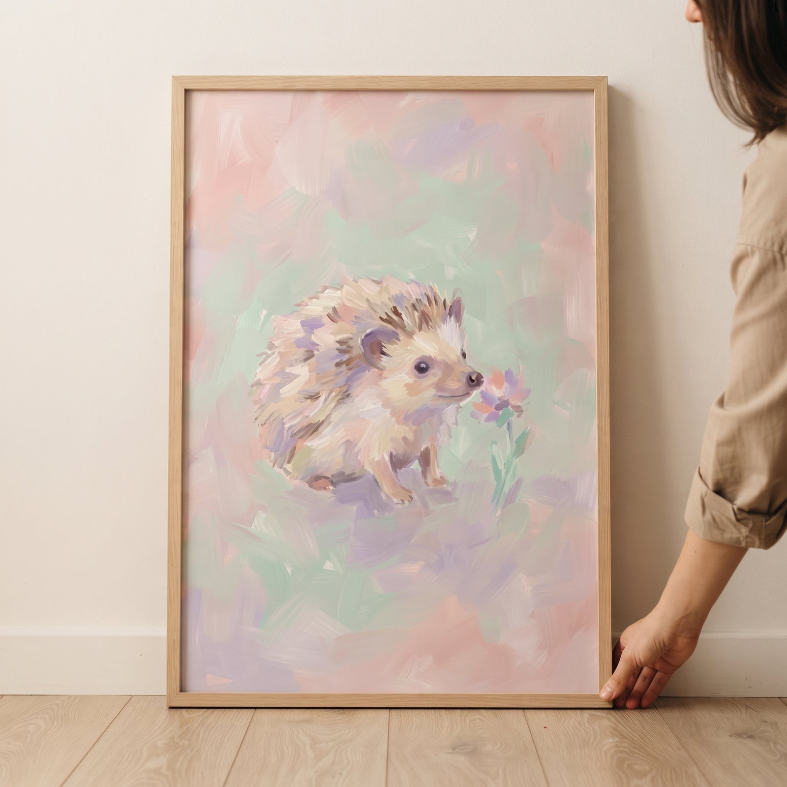 Framed pastel impressionist hedgehog wall art in soft pink and green tones, featuring a small hedgehog and a tiny flower.