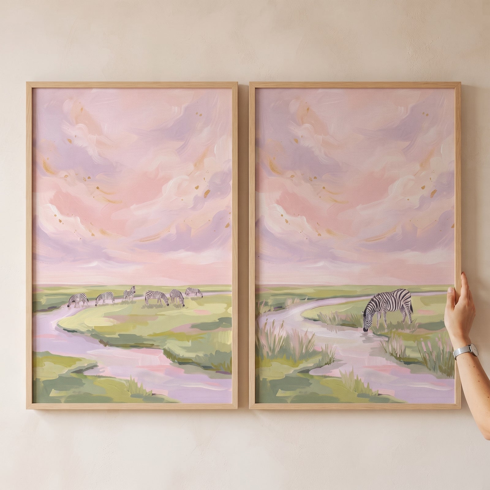 Pastel lavender sky zebra wall art set of 2 showing zebras grazing and drinking by a river in a soft landscape.