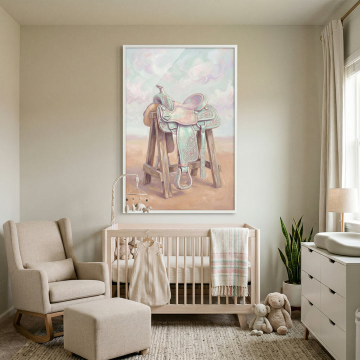 Nursery with a light wood crib, rocking chair, and a large framed pastel mint green saddle wall art.