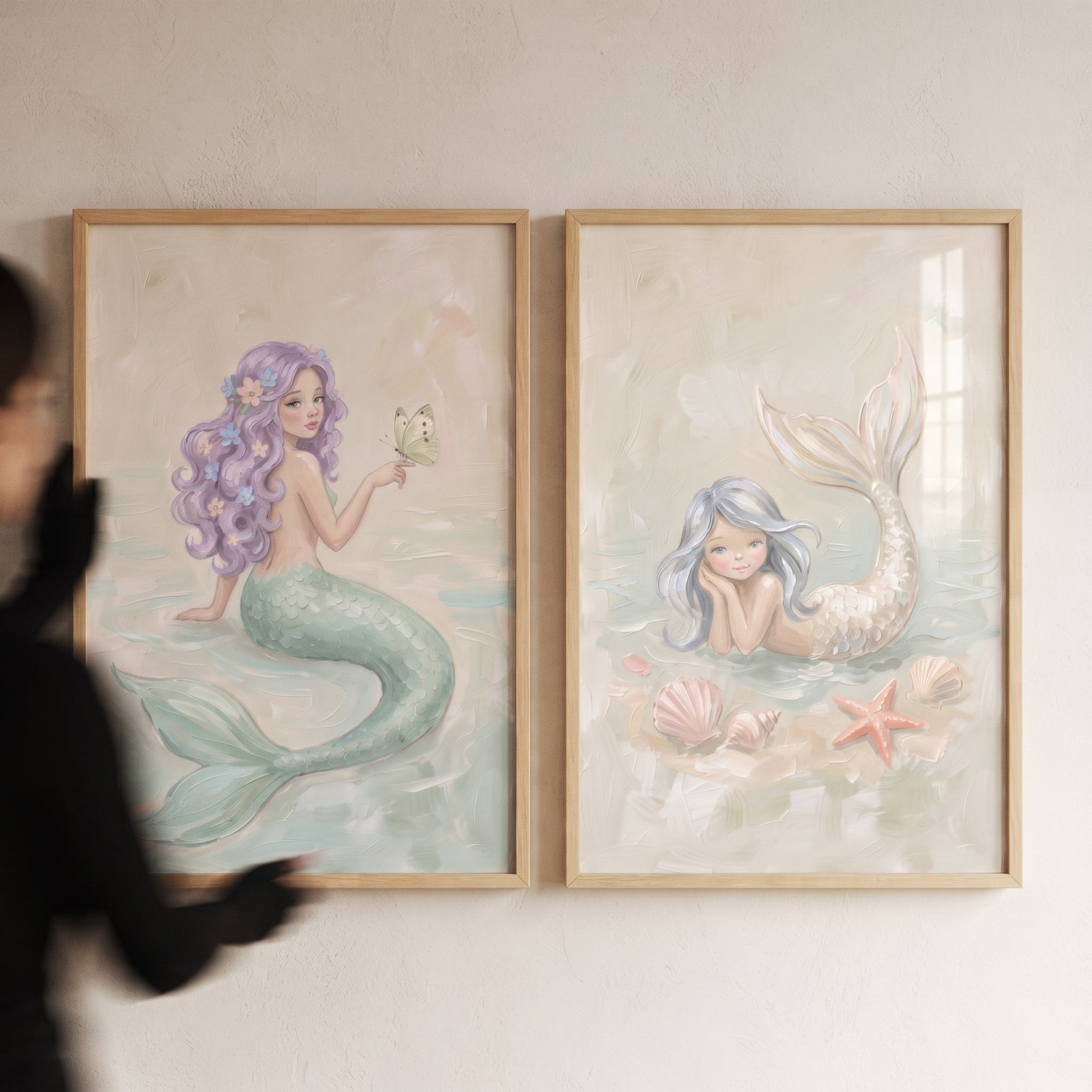 Pastel ocean fantasy mermaid wall art set of 2 features whimsical mermaids with shells, a starfish, and a butterfly.